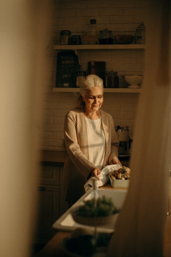 A warm and wise elder lady, smiling gently, representing Aunty Jane, the personal matchmaker.